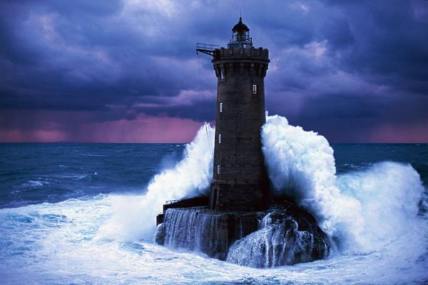 a-lighthouse-braces-itself-against-the-ocean-in-a-picture_0.jpg